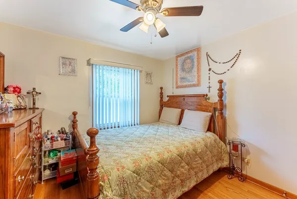 a bedroom with bed and window