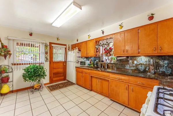 a kitchen with sink and cabinets
