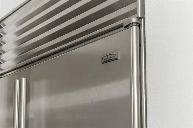 a spacious bathroom with a granite countertop sink and a mirror