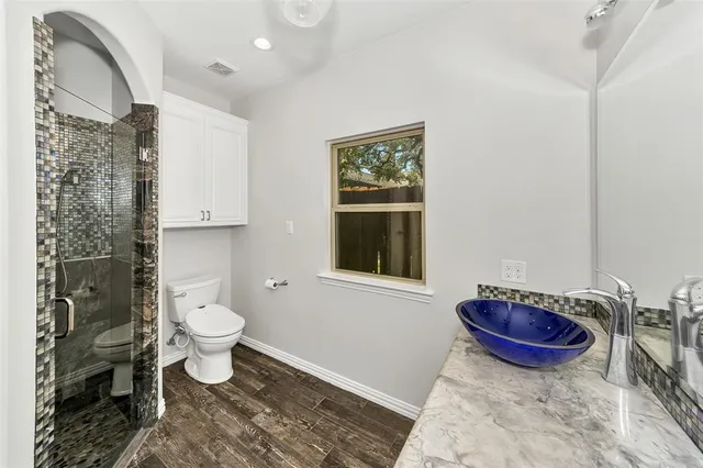 a kitchen with a sink a stove and cabinets