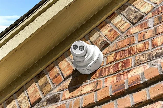 an empty room with closet and a ceiling fan