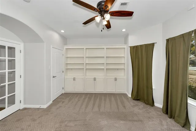 a kitchen with stainless steel appliances granite countertop a sink and a refrigerator