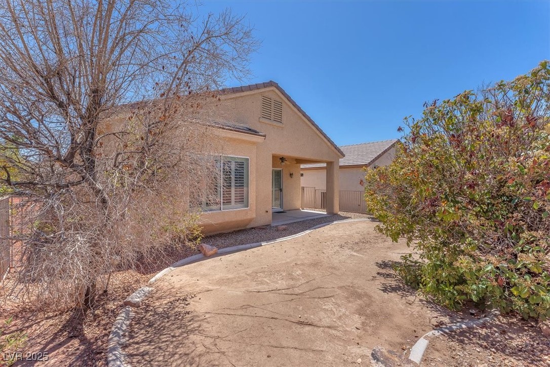 3056 Monroe Park Road Henderson, NV 89052 - Photo 24 of 28 Single story home with fence, a patio area, and stucco siding
