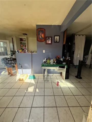 a lobby with furniture and rug