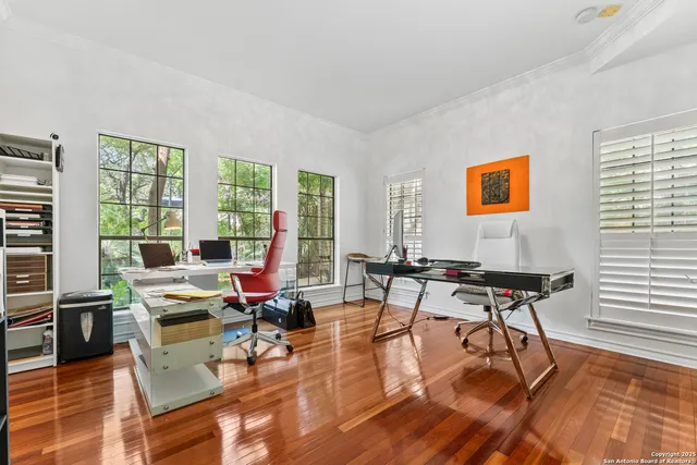 a view of a livingroom with furniture and a window