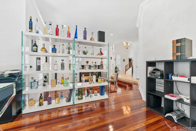 a kitchen with granite countertop white cabinets and stainless steel appliances