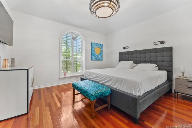 a bathroom with a double vanity sink toilet mirror and tub