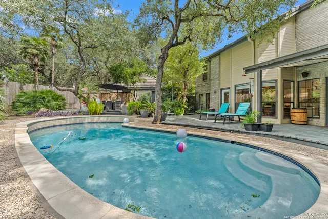 a view of outdoor space with wooden deck and furniture