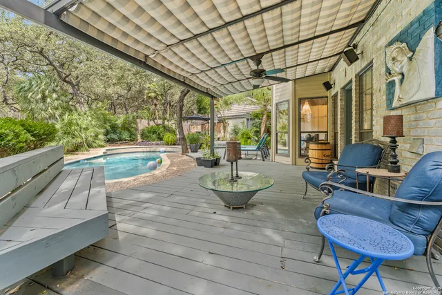 a view of a house with a yard and potted plants