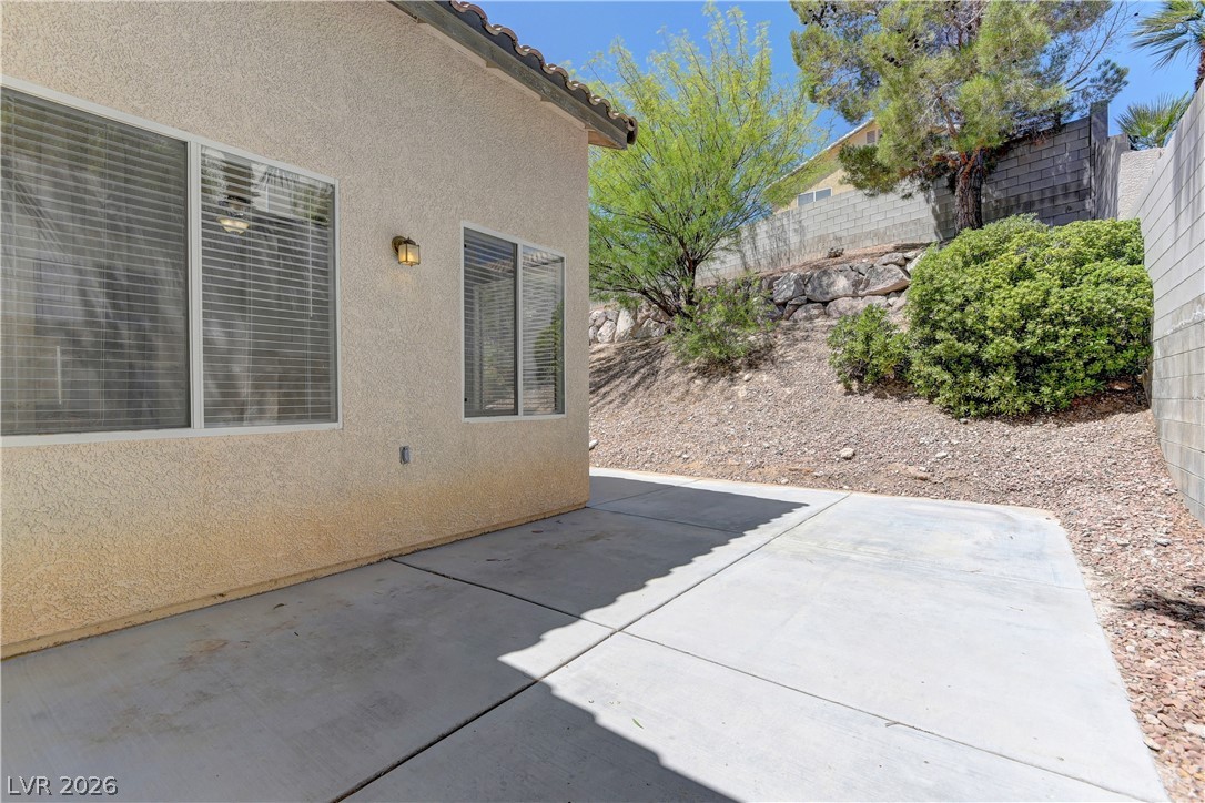 4613 Rising Cove Street Las Vegas, NV 89129 - Photo 16 of 20 This private patio area provides a serene outdoor retreat perfect for quiet enjoyment.