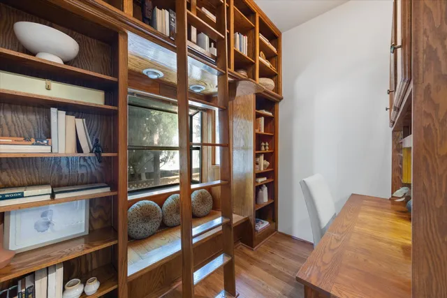 a view of balcony with furniture and wooden floor