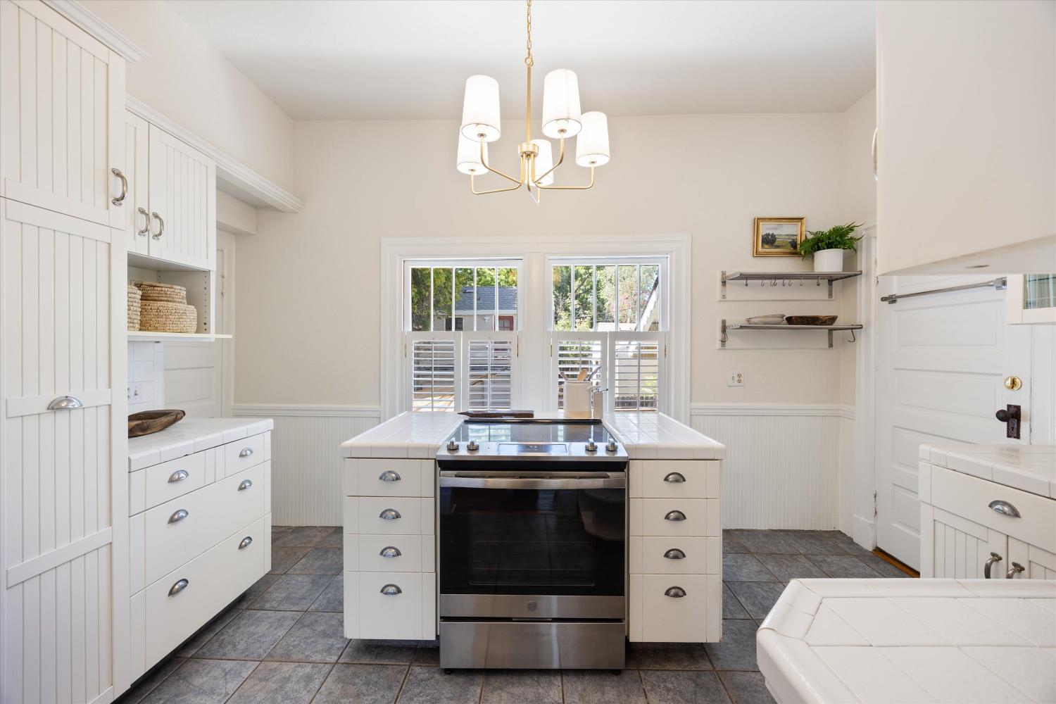 714 18th Street Sacramento, CA 95811 - Photo 14 of 43 a kitchen with a stove oven and a window