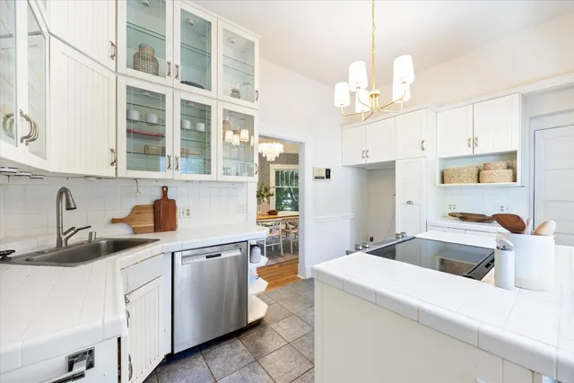 a kitchen that has a lot of cabinets in it