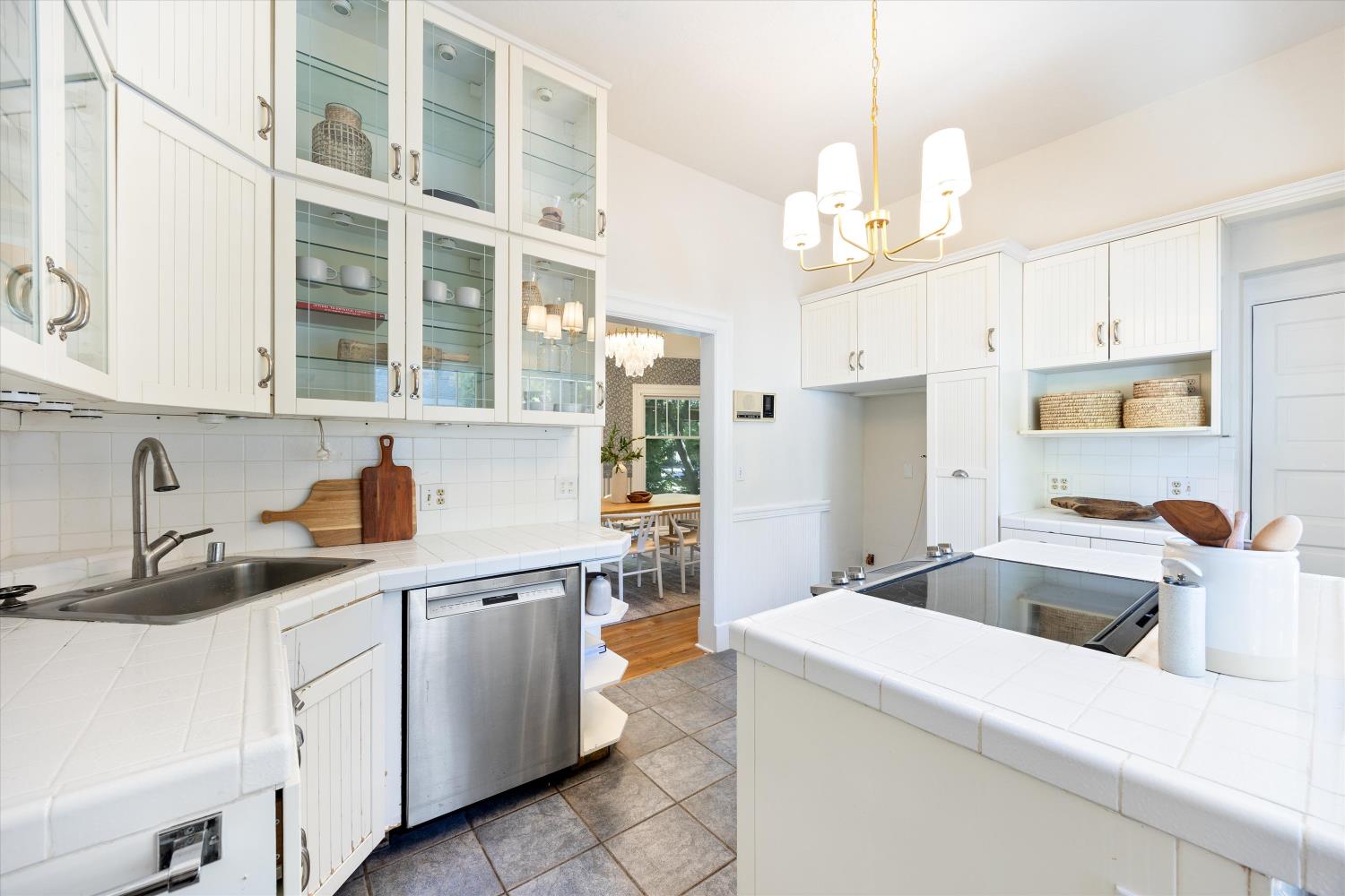 714 18th Street Sacramento, CA 95811 - Photo 15 of 43 a kitchen that has a lot of cabinets in it and wooden floors