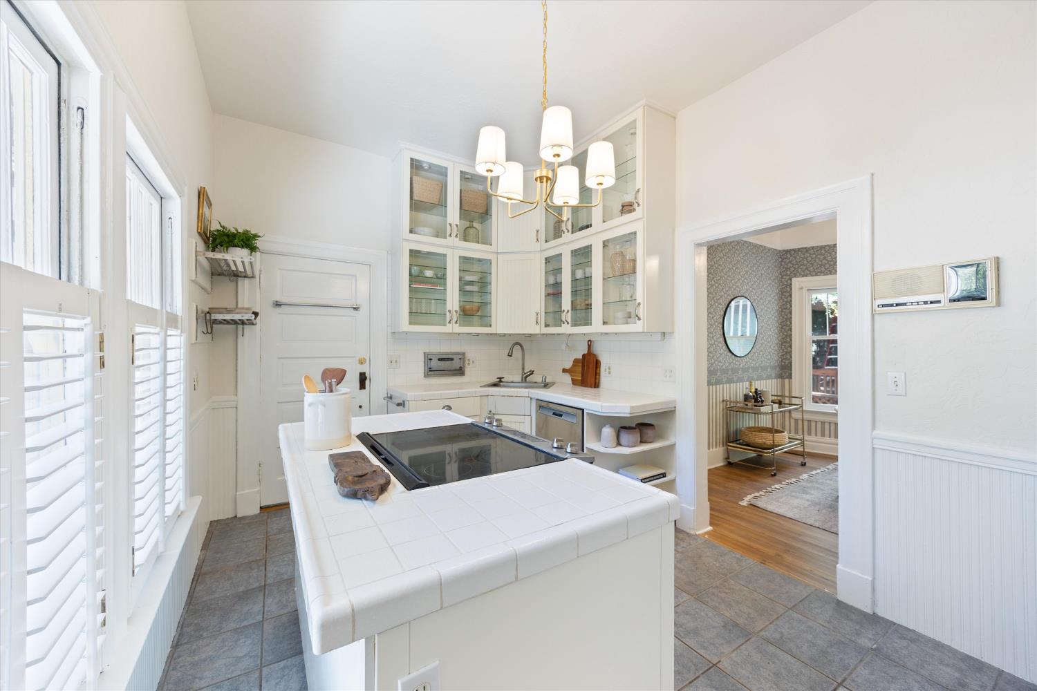 714 18th Street Sacramento, CA 95811 - Photo 16 of 43 a kitchen that has a lot of cabinets in it