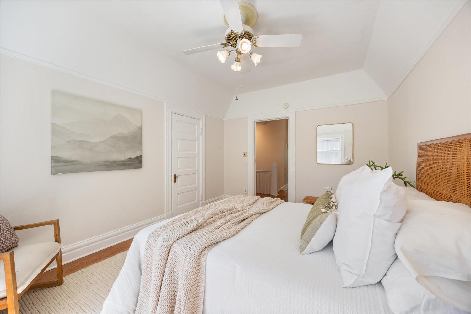 714 18th Street Sacramento, CA 95811 - Photo 20 of 43 a bedroom with a bed and a chandelier