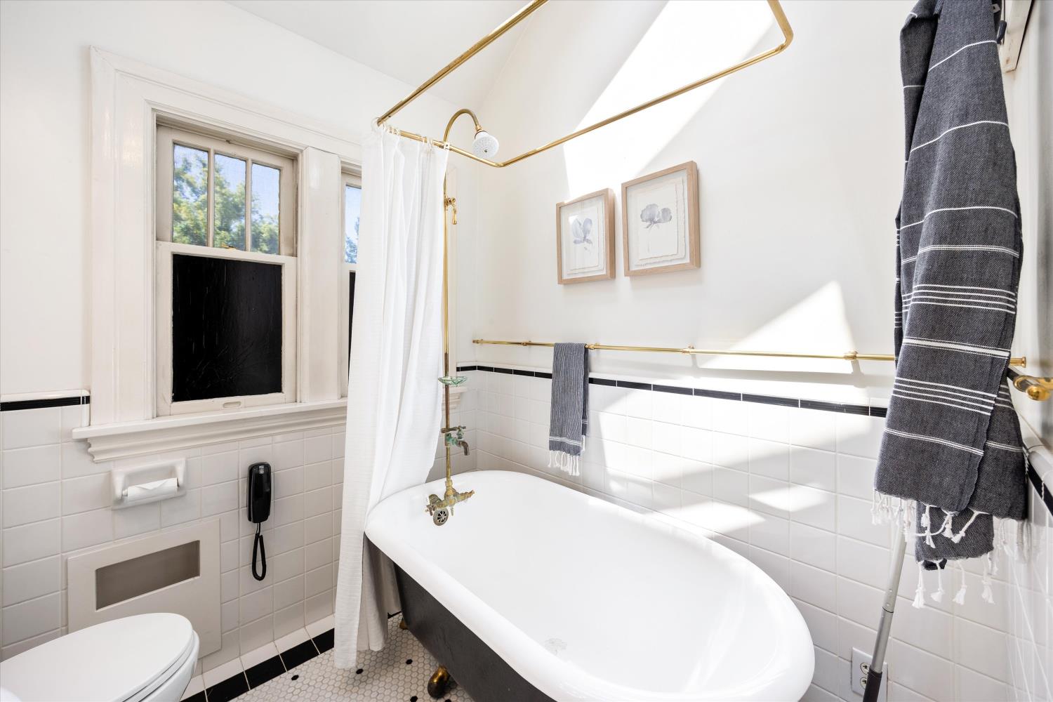 714 18th Street Sacramento, CA 95811 - Photo 24 of 43 a bathroom with a sink a toilet and a mirror
