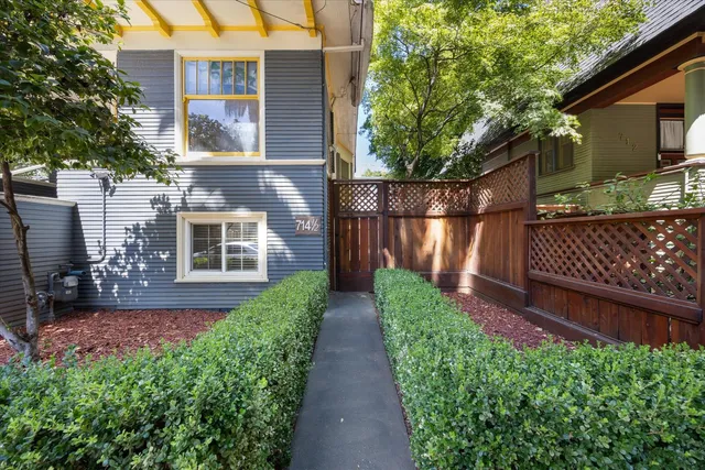 a kitchen with a stove a sink dishwasher and a refrigerator