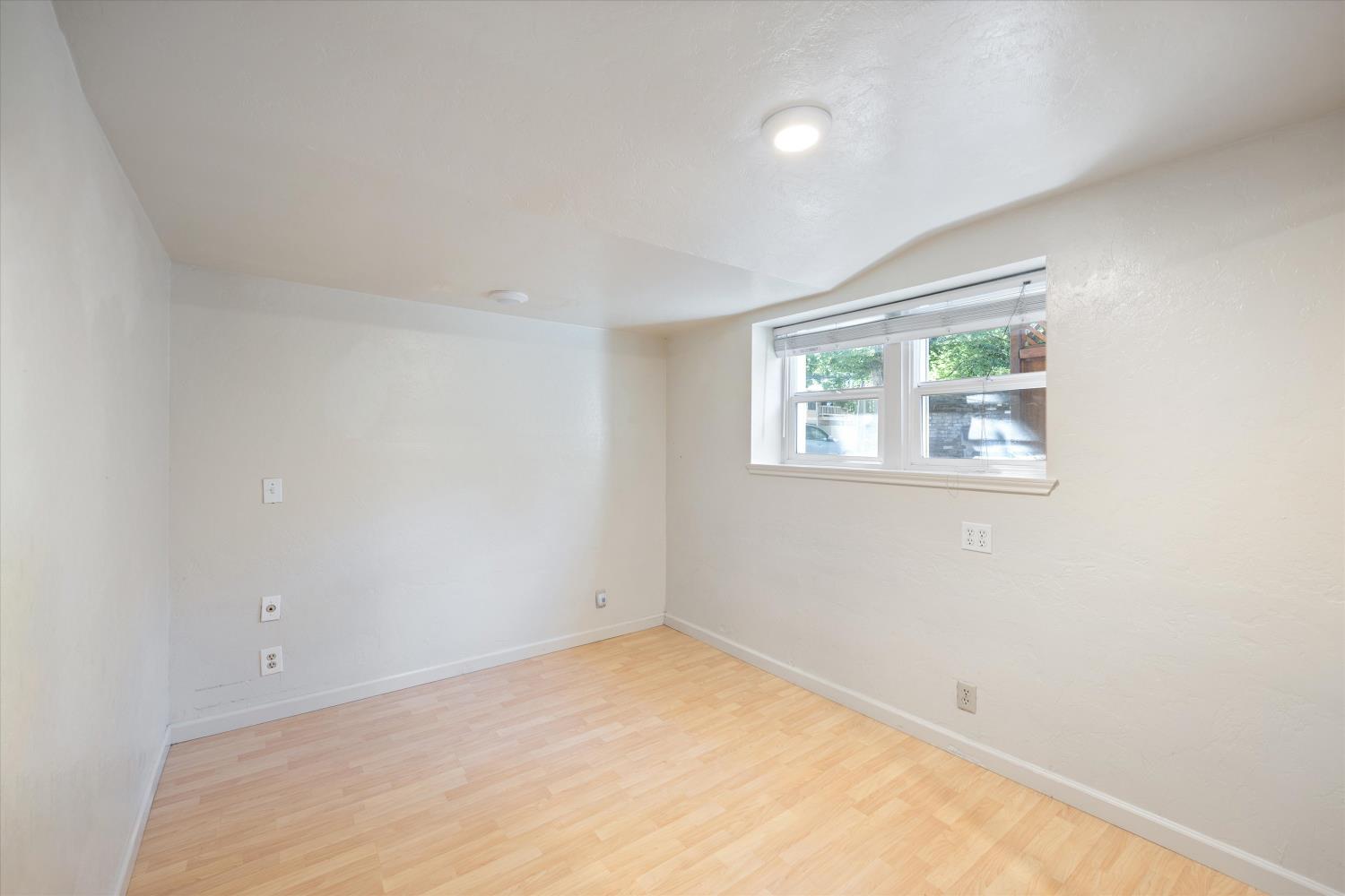 714 18th Street Sacramento, CA 95811 - Photo 33 of 43 an empty room with a window
