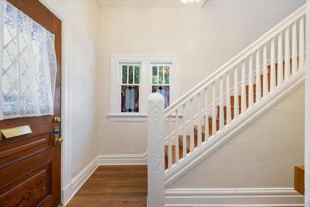 a view of an entryway with wooden floor