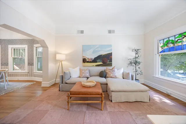 a living room with furniture and a large window
