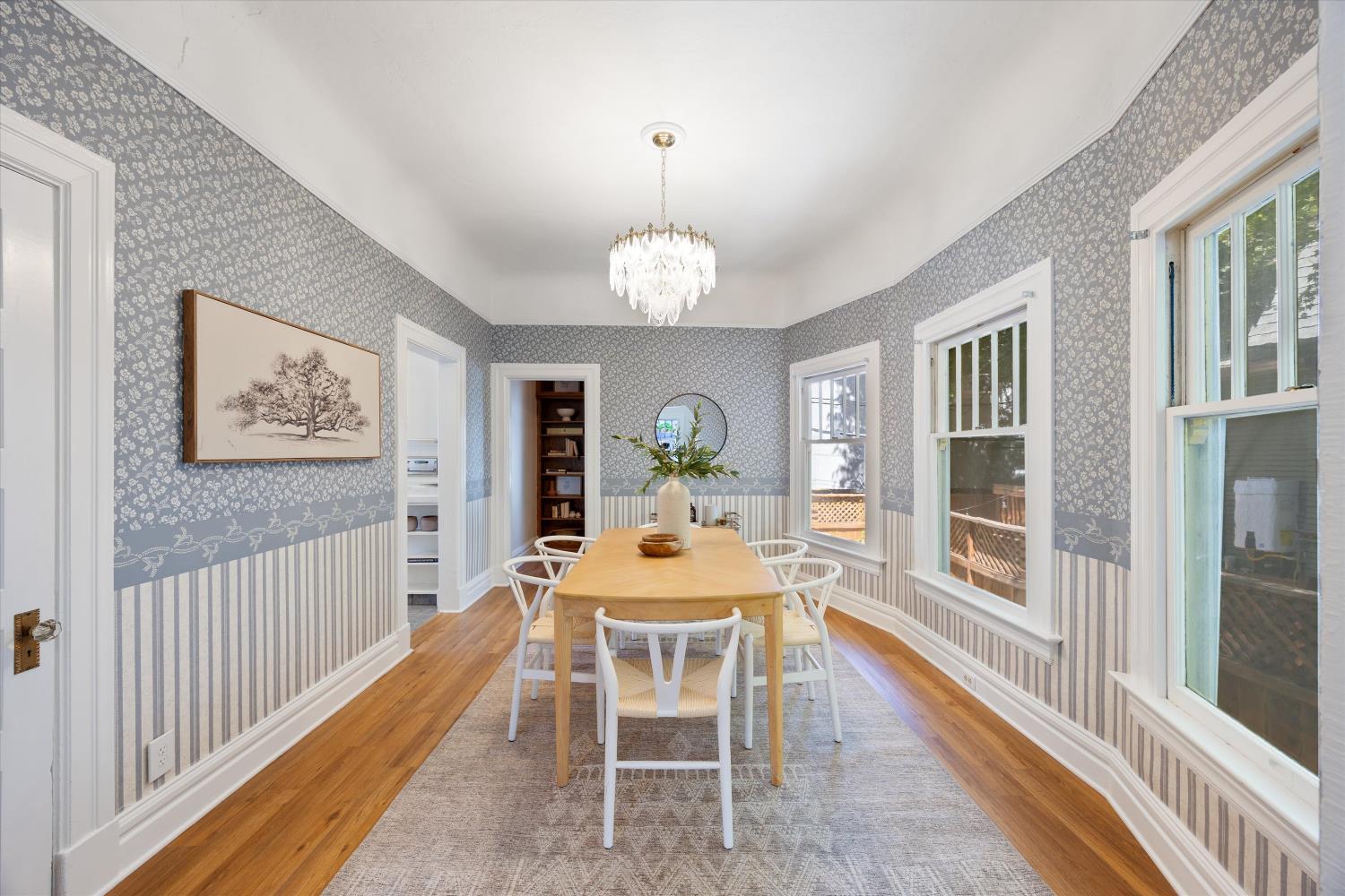 714 18th Street Sacramento, CA 95811 - Photo 10 of 43 a dining room with furniture a chandelier and wooden floor