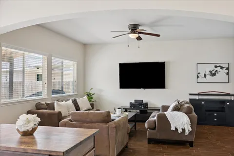 a living room with furniture and a flat screen tv
