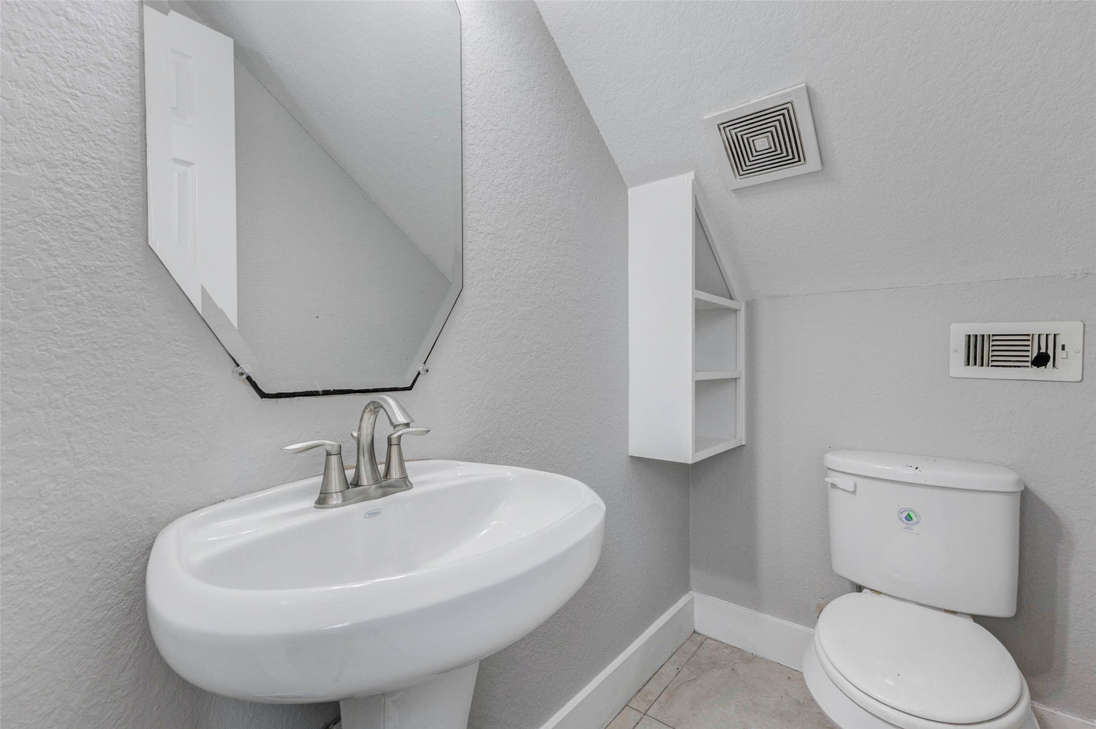 4834 Hollow Hook Road, Unit A Houston, TX 77041 - Photo 12 of 30 a bathroom with a toilet sink and mirror