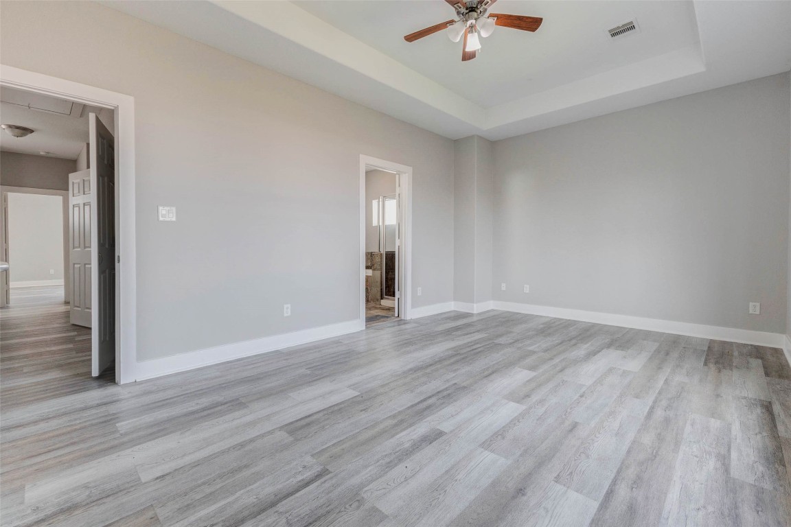 4834 Hollow Hook Road, Unit A Houston, TX 77041 - Photo 14 of 30 wooden floor in an empty room with a window