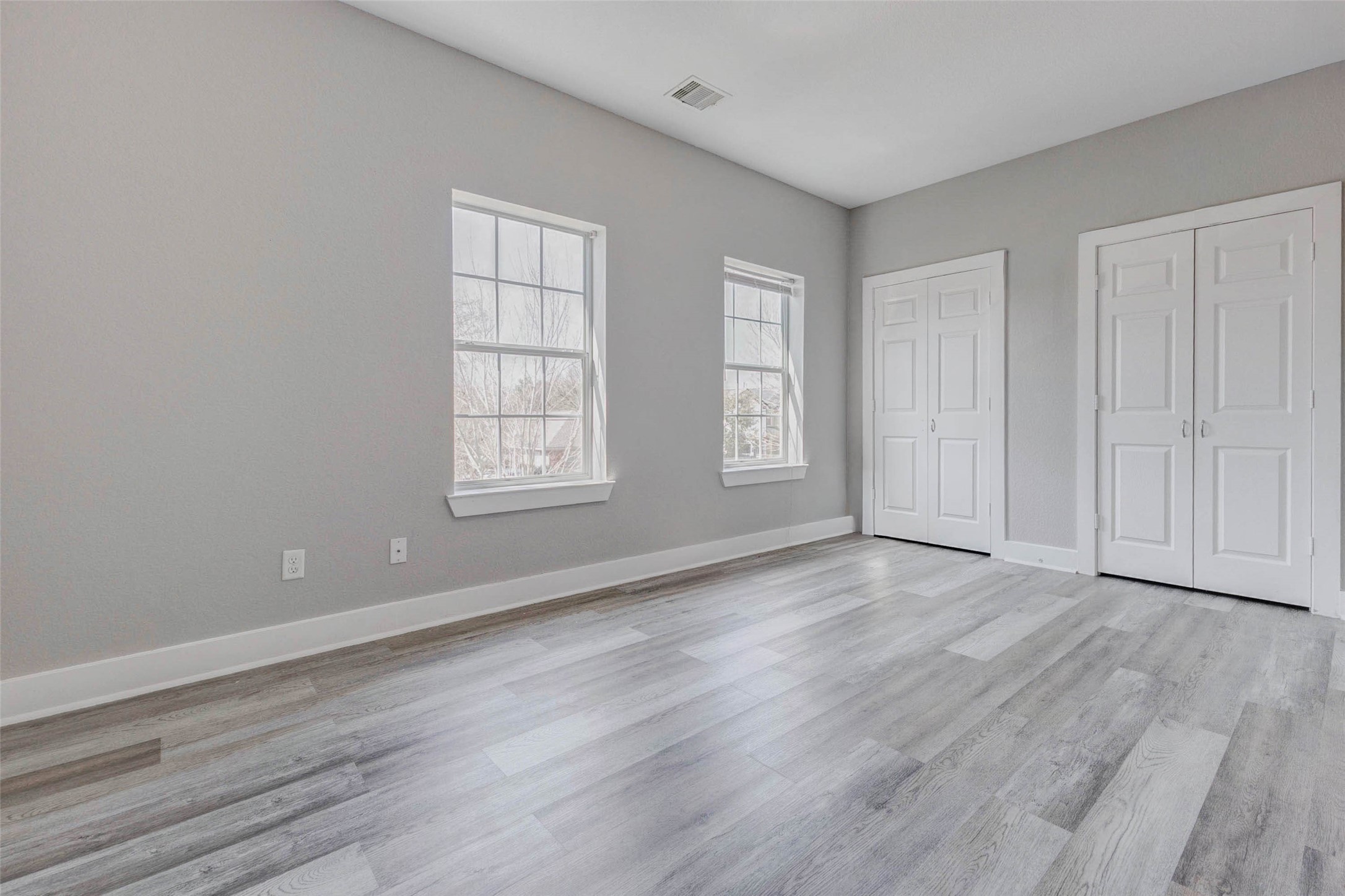 4834 Hollow Hook Road, Unit A Houston, TX 77041 - Photo 19 of 30 a view of empty room with wooden floor and fan
