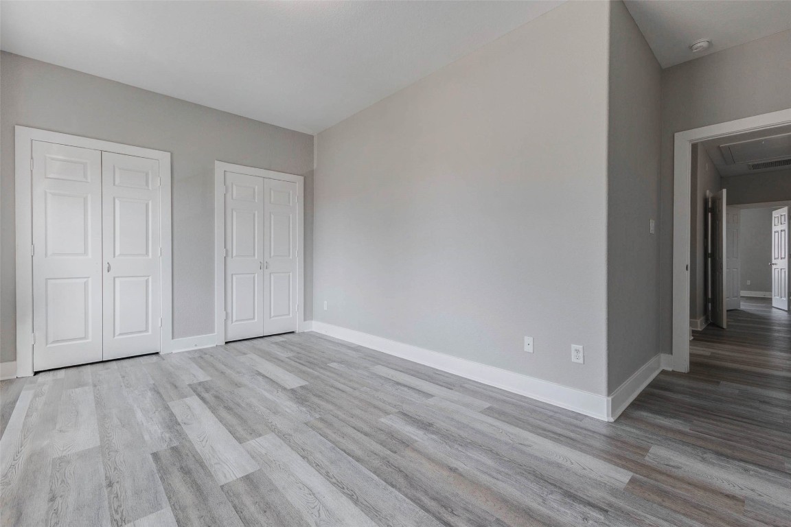 4834 Hollow Hook Road, Unit A Houston, TX 77041 - Photo 20 of 30 a view of an empty room and wooden floor