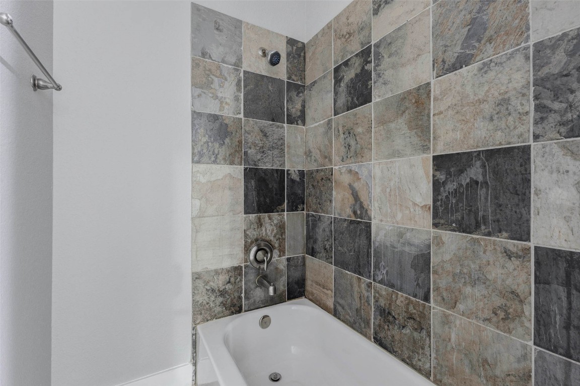 4834 Hollow Hook Road, Unit A Houston, TX 77041 - Photo 24 of 30 a bathroom with a bathtub and shower