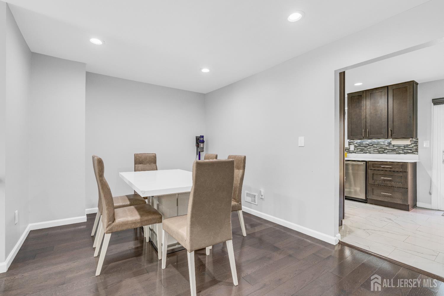 83 Pheasant Run Edison, NJ 08820 - Photo 15 of 38 a view of a dining room with furniture and wooden floor