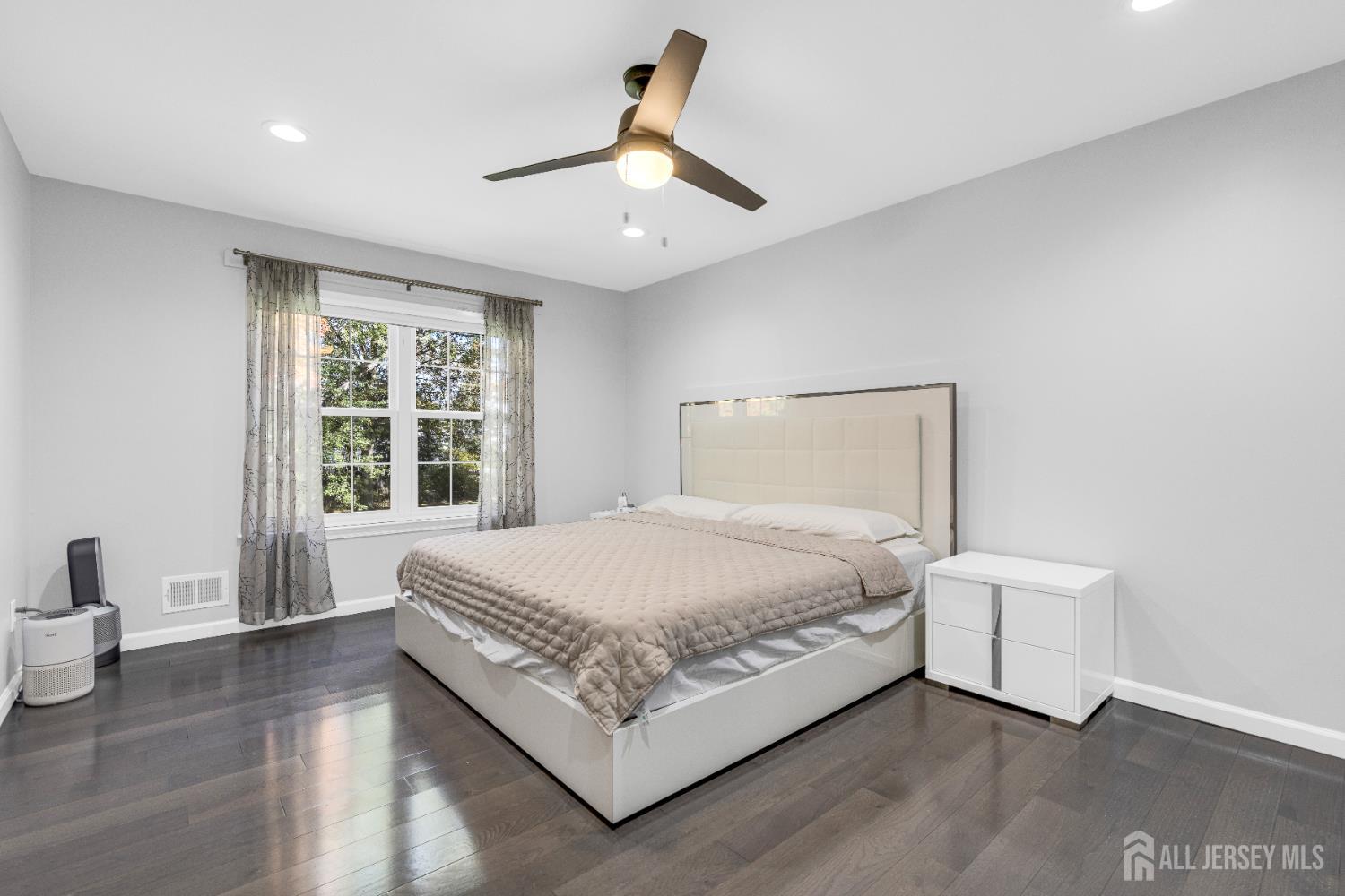 83 Pheasant Run Edison, NJ 08820 - Photo 20 of 38 a bed sitting in a spacious bedroom next to a window