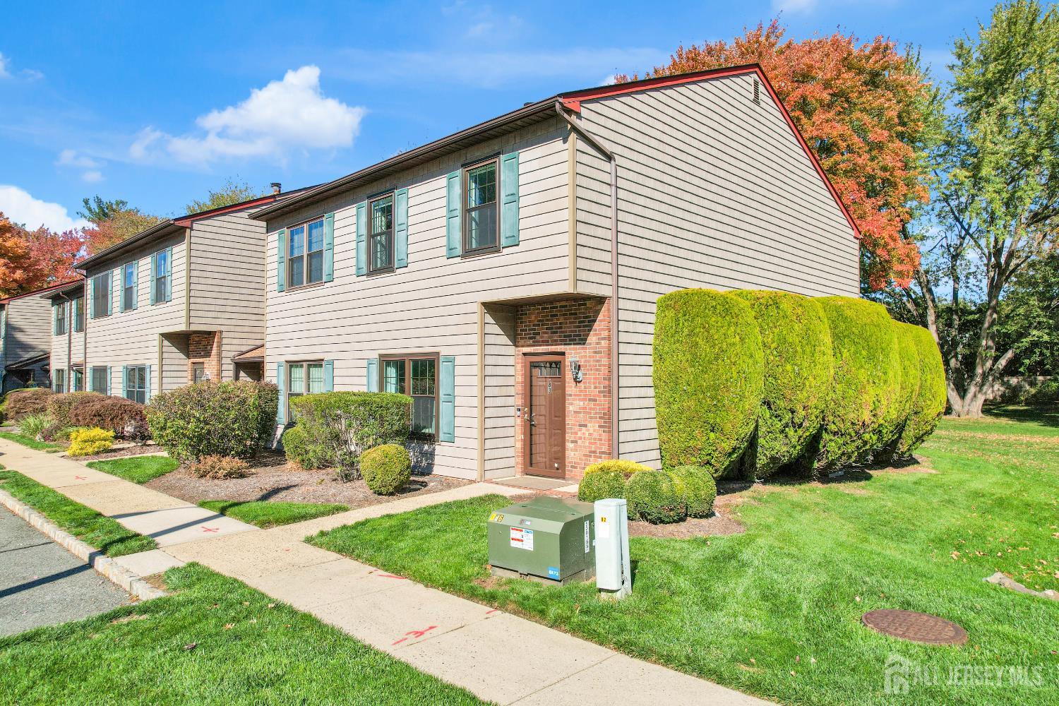 83 Pheasant Run Edison, NJ 08820 - Photo 2 of 38 a front view of a house with garden