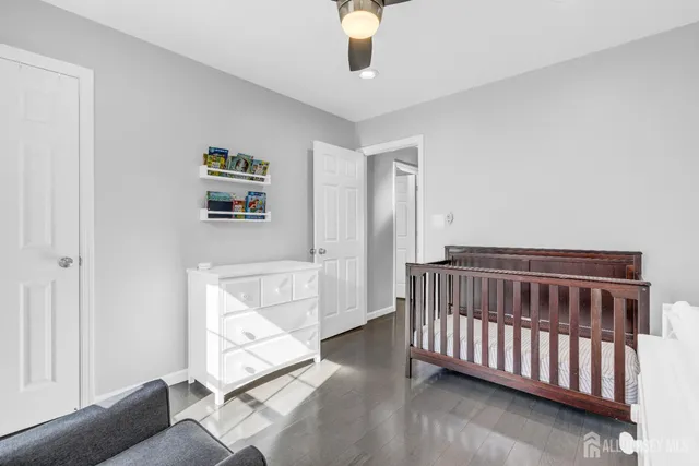 a bathroom with a granite countertop bathtub shower sink vanity and toilet