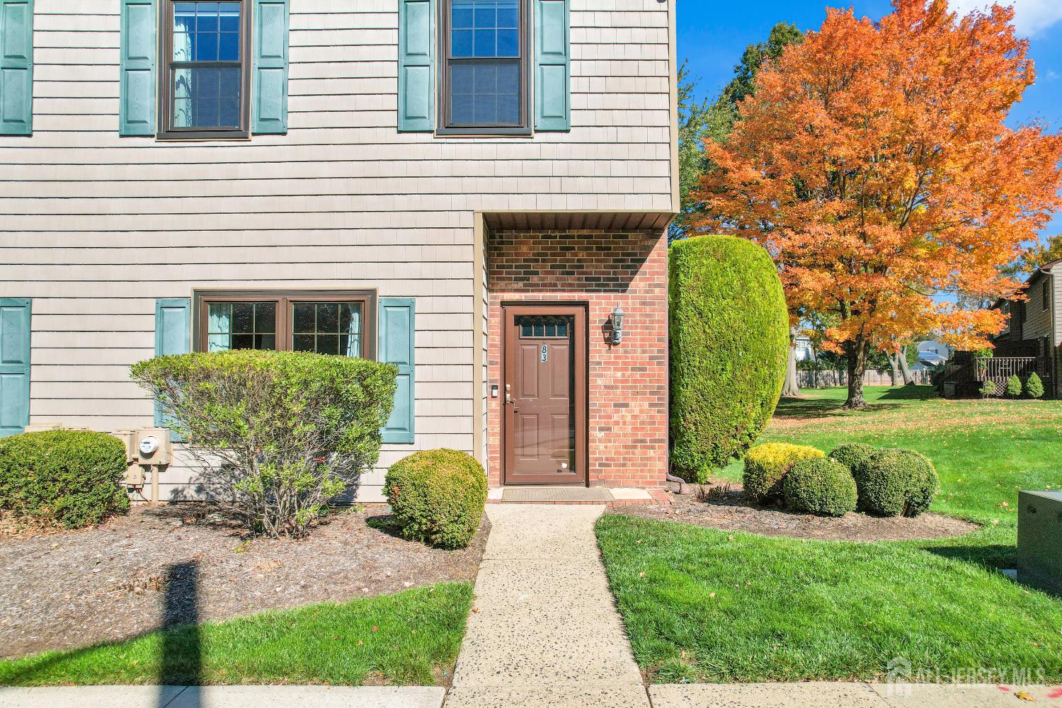 83 Pheasant Run Edison, NJ 08820 - Photo 4 of 38 a front view of a house with garden