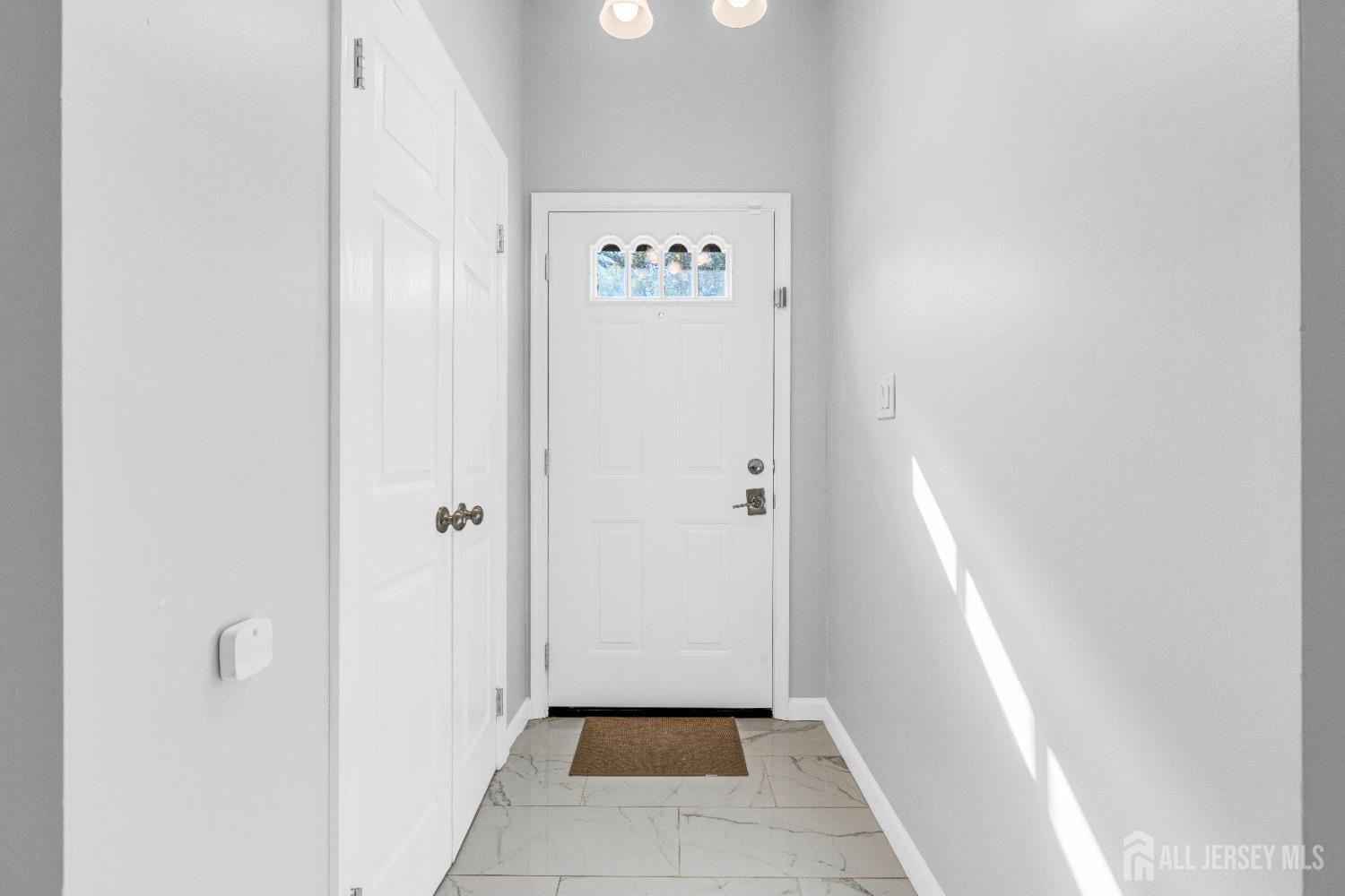 83 Pheasant Run Edison, NJ 08820 - Photo 5 of 38 a view of a hallway with wooden floor