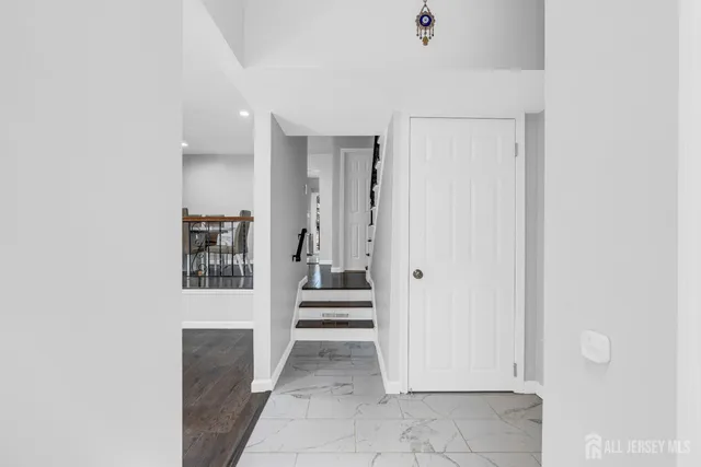 a view of a hallway with wooden shelves