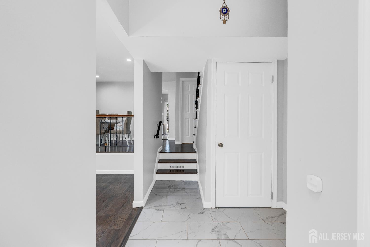 83 Pheasant Run Edison, NJ 08820 - Photo 6 of 38 a view of a hallway with wooden shelves