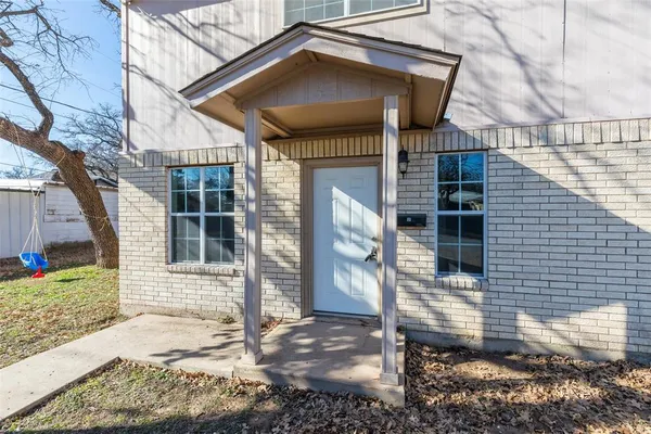 a front view of a house with parking