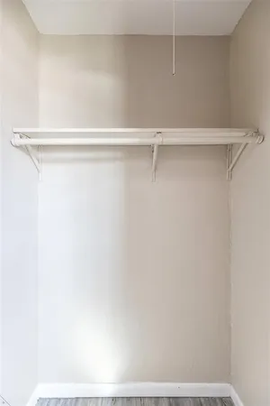 a bathroom with a sink a toilet and a window