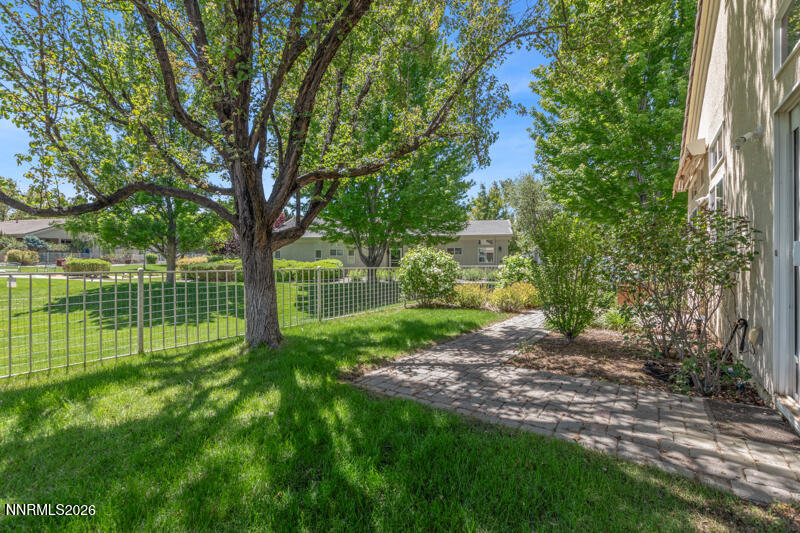 403 Sierra Leaf Circle Reno, NV 89511 - Photo 3 of 25 a view of a garden with a tree