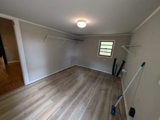 a view of a storage & utility room with closet