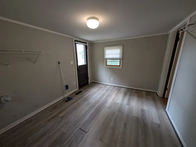 a kitchen with a refrigerator and a sink