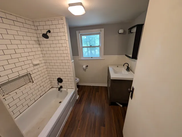 a view of entryway with wooden floor