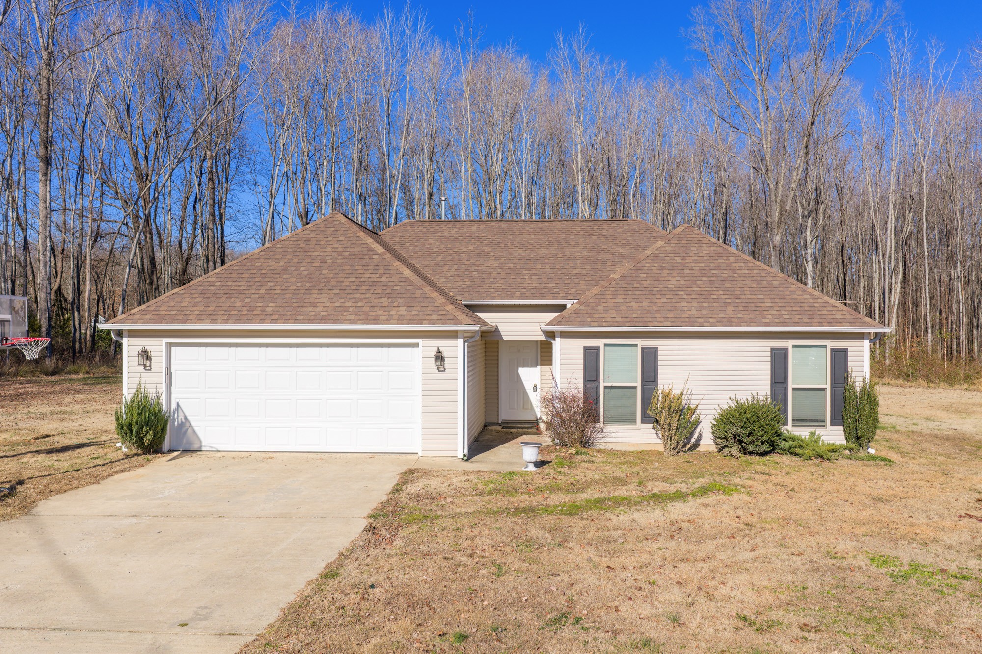 a view of a house with a yard and garage