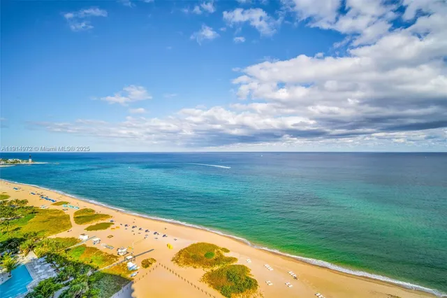 a view of swimming pool from a balcony