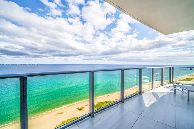 a large bedroom with a large bed and a flat screen tv