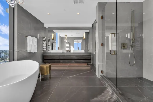 a large bathroom with a double vanity sink and a mirror